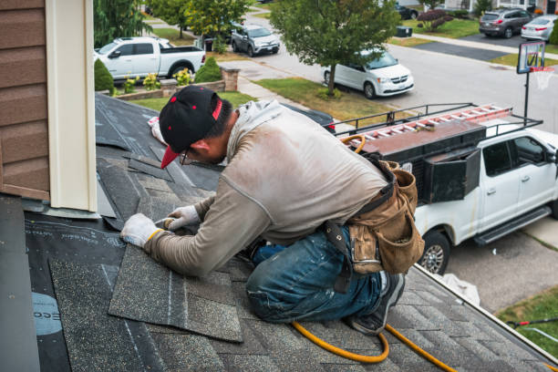 Professional Roofing technician working in Needham, MA